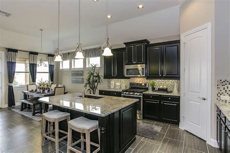 While the model can be adjusted to your needs, for example if you have passable flavor, you can select a closed shelf. Gehan Homes Kitchen - Black Cabinets, Light Granite ...
