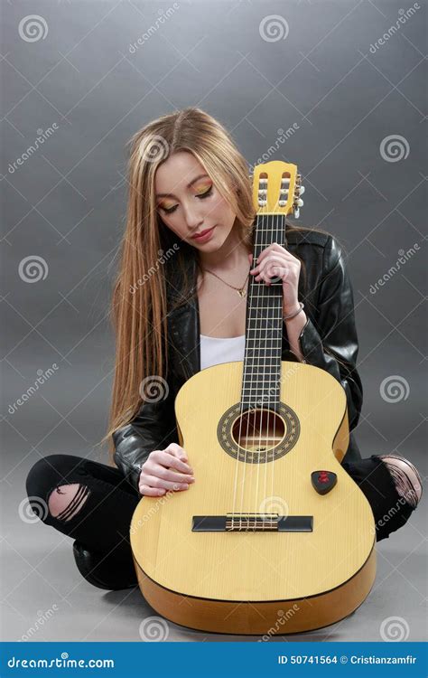 A Beautiful Young Blonde With A Classical Guitar Stock Photo Image Of