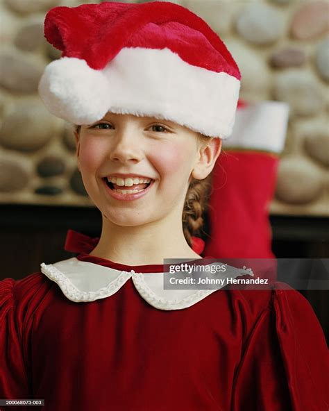Girl Wearing Santa Hat Portrait High Res Stock Photo Getty Images