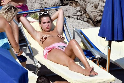 Dua Lipa Sunbathing At A Beach In Capri Hawtcelebs