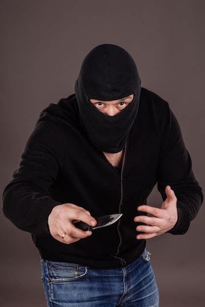 Premium Photo Burglar Or Robber With Knife