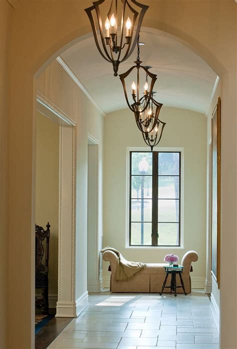 Serene Hallway With Arched Ceiling Pendant Lighting By Barnesvanze