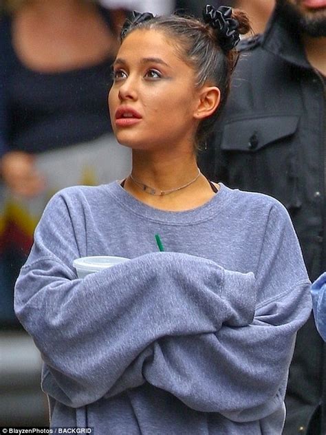 Ariana Grande Skips In The Rain While Out With Friends In New York