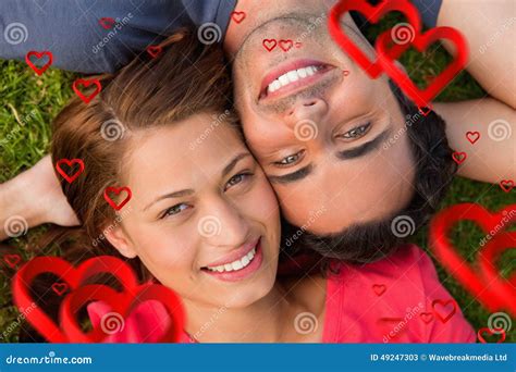 Composite Image Of Close Up Of Two Friends Looking Upwards While Lying