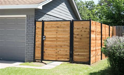 Neither posts nor rails can be seen on the outside of this fence. Residential Wood Fence Installation Houston | Aber Fence