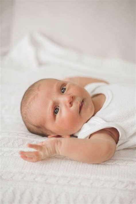 Little Cute Newborn Is Lying On The Bed Baby Stock Photo Image Of