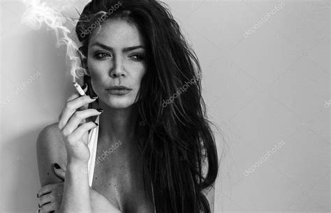 Elegant Brunette Woman Smoking A Cigarette Stock Photo By Appearagain