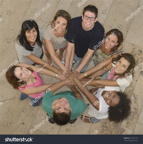 Teamwork Group Of Young And Diverse People Joining Hands Stock Photo