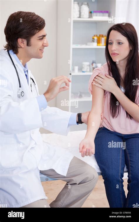 Male Doctor About To Give An Injection To Patient Stock Photo Alamy