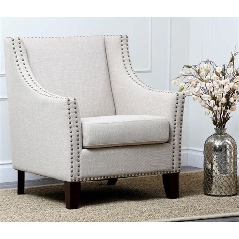 Selecting a chair in two tones is a great way to create contrast within one piece of furniture. Shop Abbyson Living Soho Cream Fabric Nailhead-trim ...