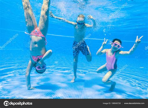Little Kids Swimming Pool Underwater — Stock Photo © Yanlev 199545728