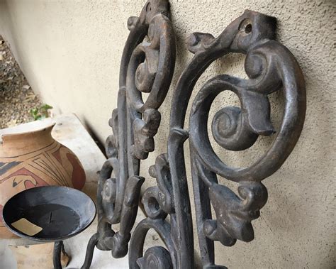 Pair Of Heavy Cast Iron Spanish Revival Wall Mounted Candle Holder