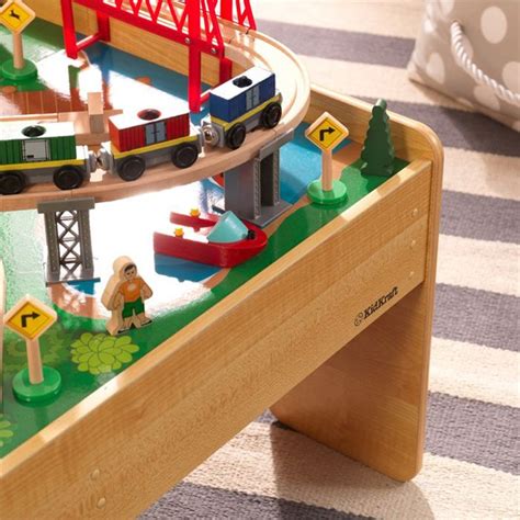 The train table features an espresso finish and solid wood. KidKraft 120 Piece Adventure Town Railway Train Table Set ...