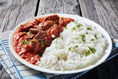Beef Stew With Rice On A White Plate Stock Image Image Of Meal