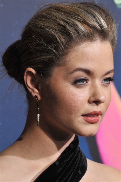 Low bun with a side part and accesories. 20 Best Celebrity Bun Hairstyles for Long Hair