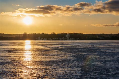 Winter Landscape With Frozen Lake At Sunrise Or Sunset Lake Glistening