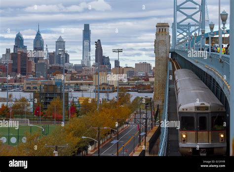 Patco Train Crossing The Ben Franklin Bridge In The Fall Stock Photo