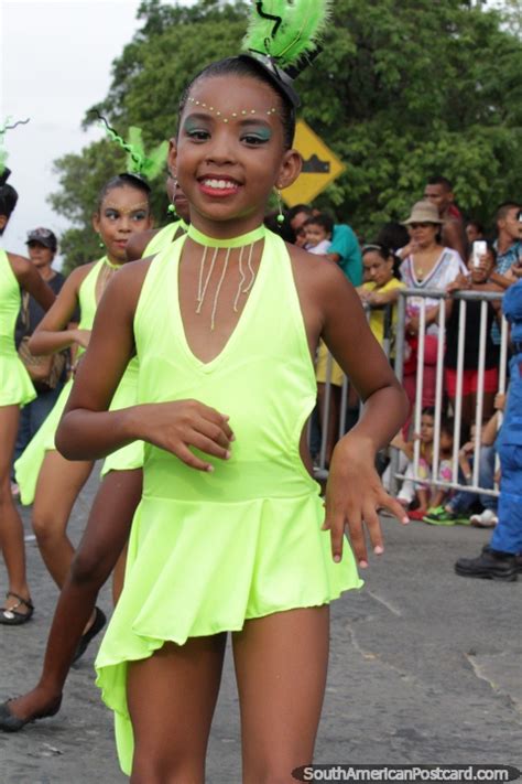 Young Girl Dressed Beautifully In Green Performs At The Festival Of The