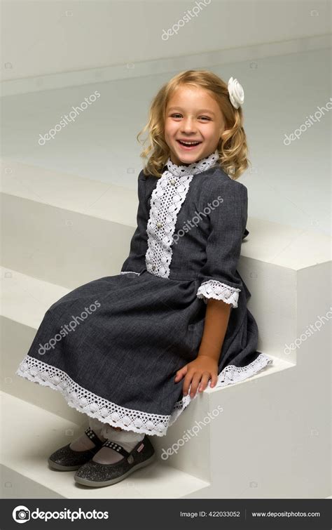 Charming Little Girl Laughing Happily In Studio Stock Photo By