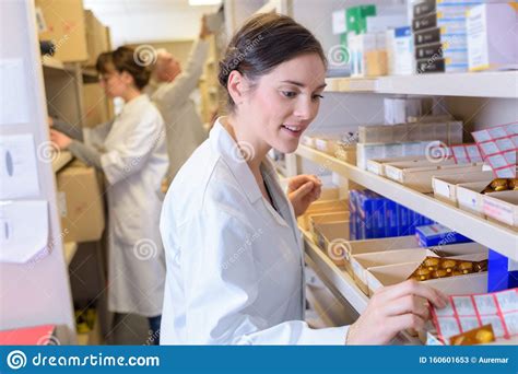 Pharmacist Selecting Medication Stock Image Image Of Brunette Cure