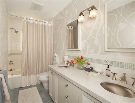 This tiny bathroom is made to feel much larger by the inclusion of mirror all around the room. Making Your Bathroom Look Larger With Shower Curtain Ideas
