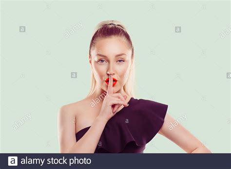 Woman Wide Eyed Asking For Silence Or Secrecy With Finger On Lips Hush
