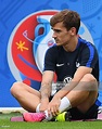 France's forward Antoine Griezmann stretches at the end of a training ...