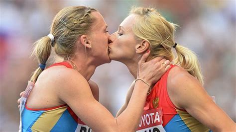 russian runners deny podium kiss was protest against anti gay law abc news