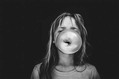 Black And White Photo Of Girl Blowing Bubble Gum By Mickie Devries