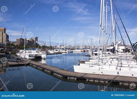 Yachts Moored At Wilsons Wharf Against City Skyline Editorial Image