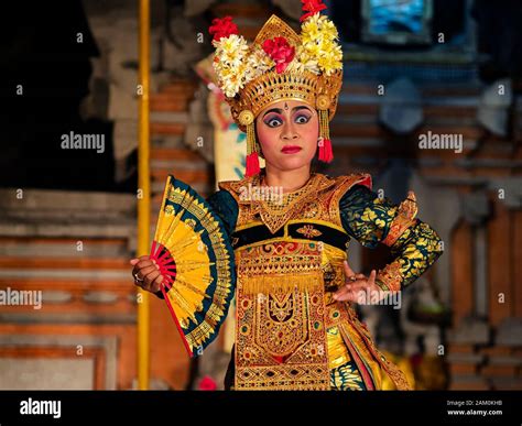 Balinese Dancer Performing Legong Dance Wearing Traditional Costumes At