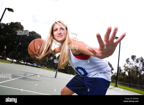 Action Shot Of A Woman Playing Basketball Stock Photo Alamy