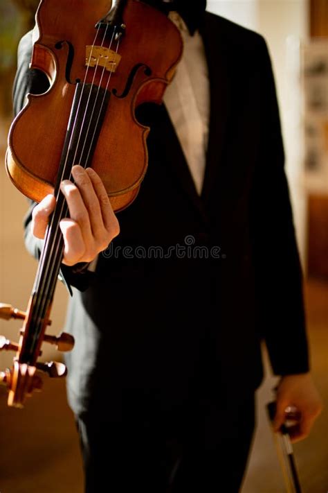 Unrecognizable Elegant Professional Musician Hold Violin In Hands Stock