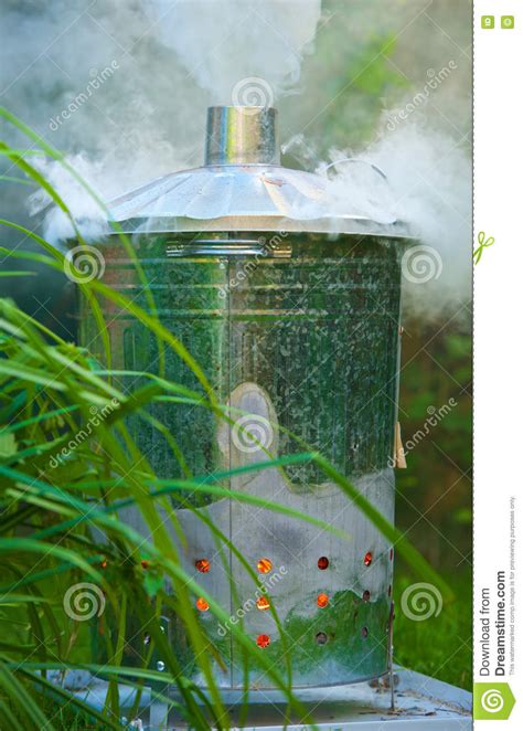 These have passed tests to ensure that they burn without producing. Photo Of A Galvanized Incinerator Burning Garden Waste ...