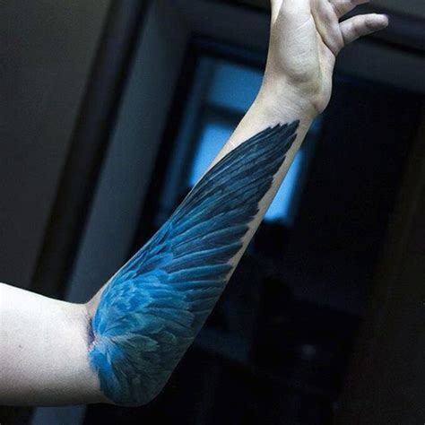 Realism Style Blue Colored Forearm Tattoo Of Birds Wing Tattooimagesbiz