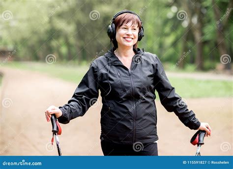 Woman Walking With Hiking Sticks Stock Image Image Of Sporty Forest