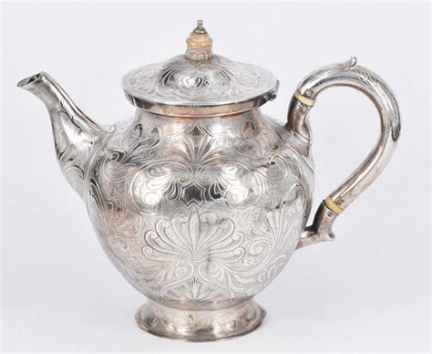 A Victorian Sterling Silver Teapot All Over Lightly Engraved Tea
