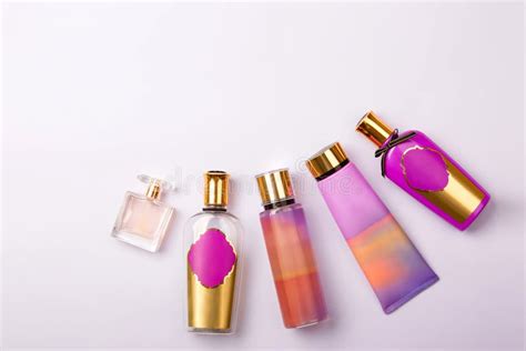 Premium Skin Care Cosmetics And Perfume On Purple Background Stock