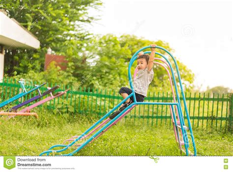 Little Asian Kid Playing Slide At The Playground Stock Image Image Of