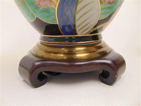 Make your home come alive. Pair of Hand Painted Ceramic Floral Urn Style Table Lamps by Wildwood Lamps For Sale at 1stDibs