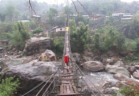 Wood Bridge Crossing On The Annapurna Circuit In Nepal Photograph By