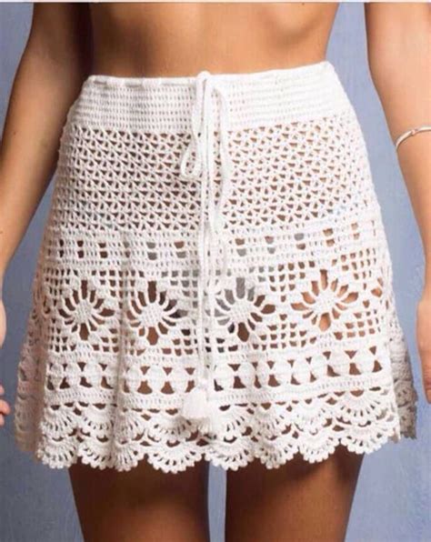 A Woman Wearing A White Crochet Skirt