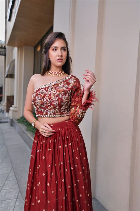 red lehenga with one shoulder blouse suruchi parakh east boutique red lehenga wedding