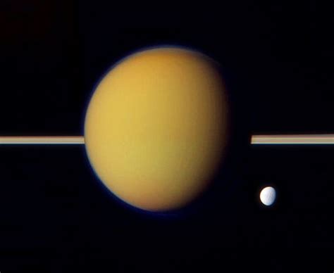 Computer Image Of Saturns Moons Titan And Dione May 2011 Saturns