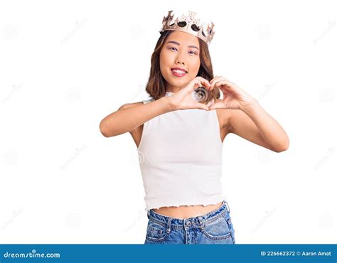 Young Beautiful Chinese Girl Wearing Princess Crown Smiling In Love