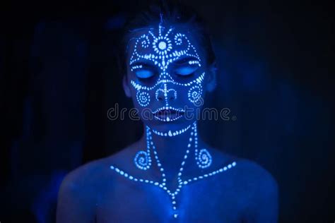 Body Art On The Body And Hand Of A Girl Glowing In The Ultraviolet