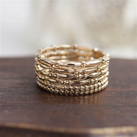 Maybe you would like to learn more about one of these? 14k solid gold stack ring stackable gold band bead ring