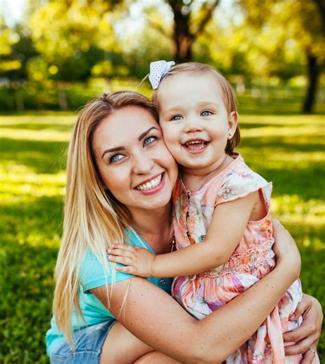 premium photo happy mom and daughter smiling at nature