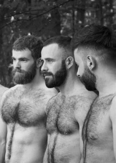 Three Men With Beards Standing In Front Of Trees