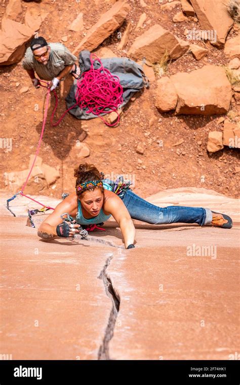Female Rock Climber Makes Her Way Up A Crack System In Grand Junction